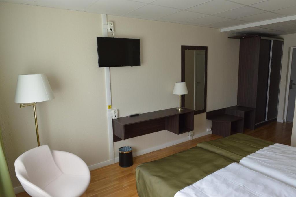 Postel nebo postele na pokoji v ubytování Hotell Nova
