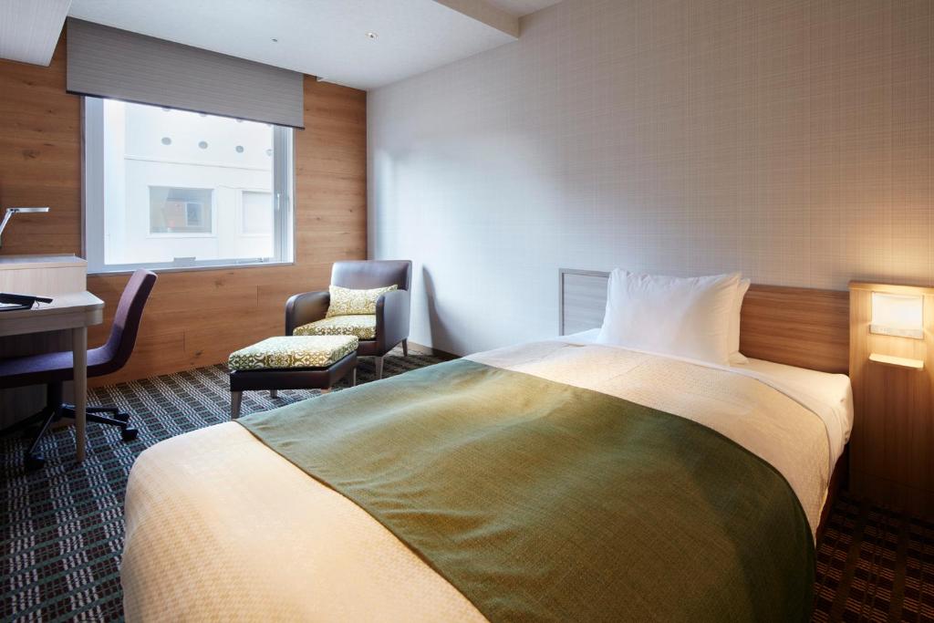 Postel nebo postele na pokoji v ubytování Garden Hotel Shizuoka