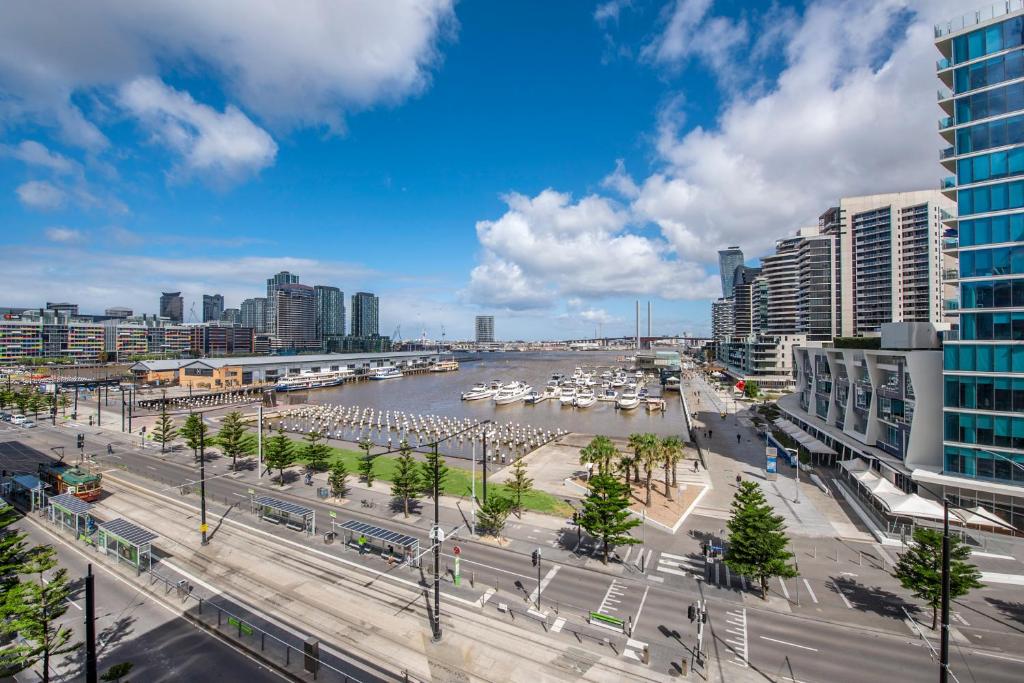 a view of a city with a river and buildings at Docklands Private Collection - Digital Harbour in Melbourne