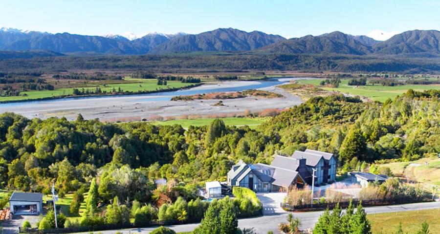 an aerial view of a house and a river at Rimu Lodge in Hokitika