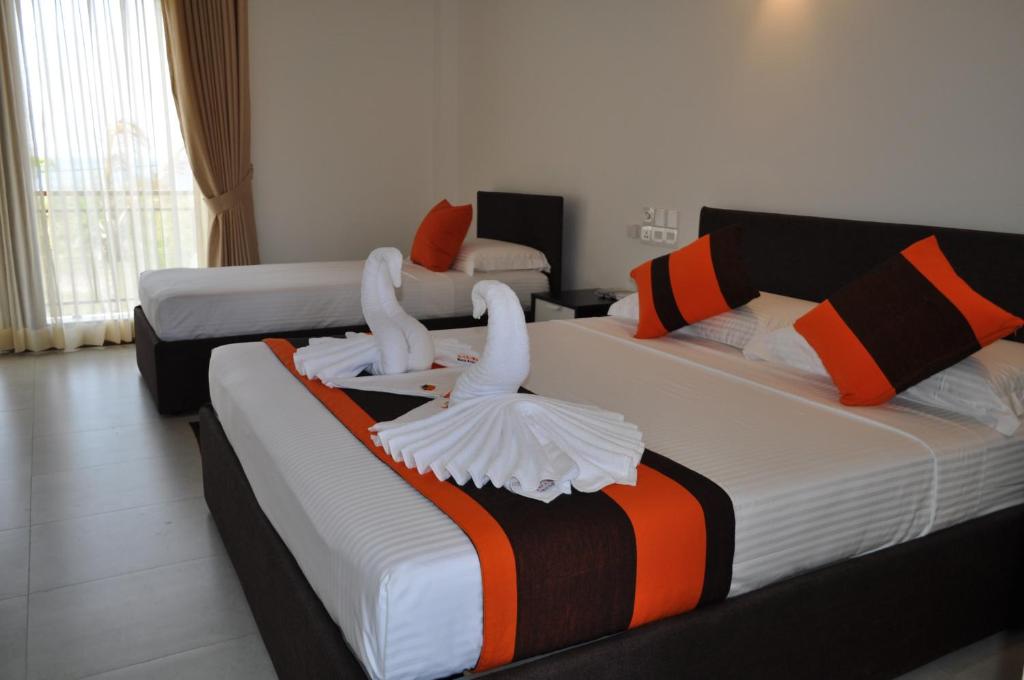 Postel nebo postele na pokoji v ubytování Amanda Beach Resort