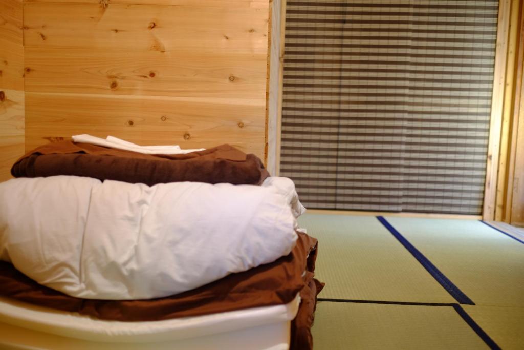 Postel nebo postele na pokoji v ubytování Hakone Guesthouse Toi