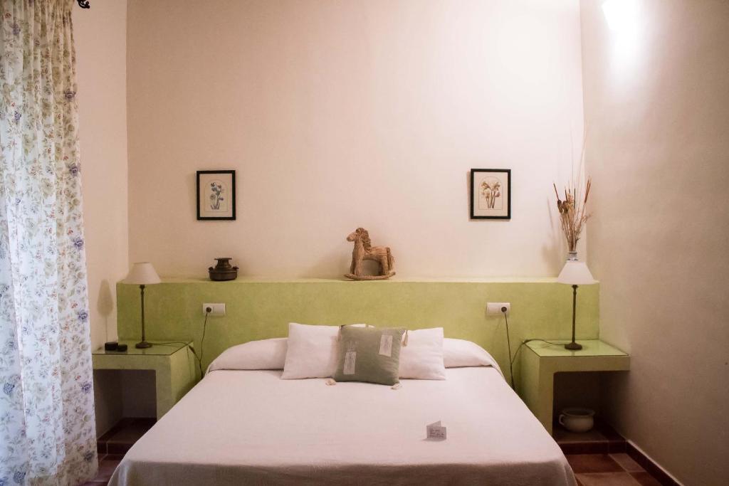 Postel nebo postele na pokoji v ubytování La Casa de Las Titas