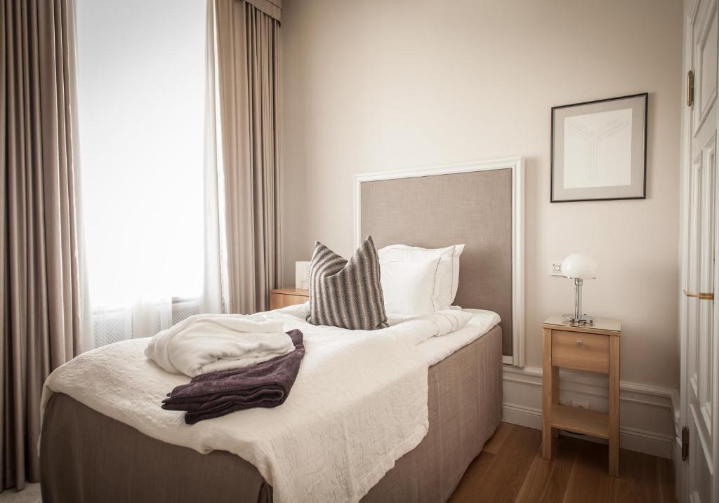 Postel nebo postele na pokoji v ubytování Hotel Villa Anna
