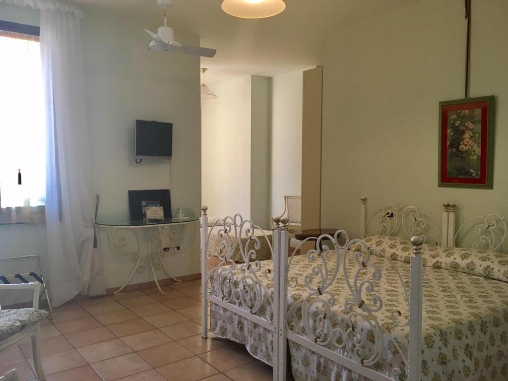 Postel nebo postele na pokoji v ubytování Villa Scalabrini