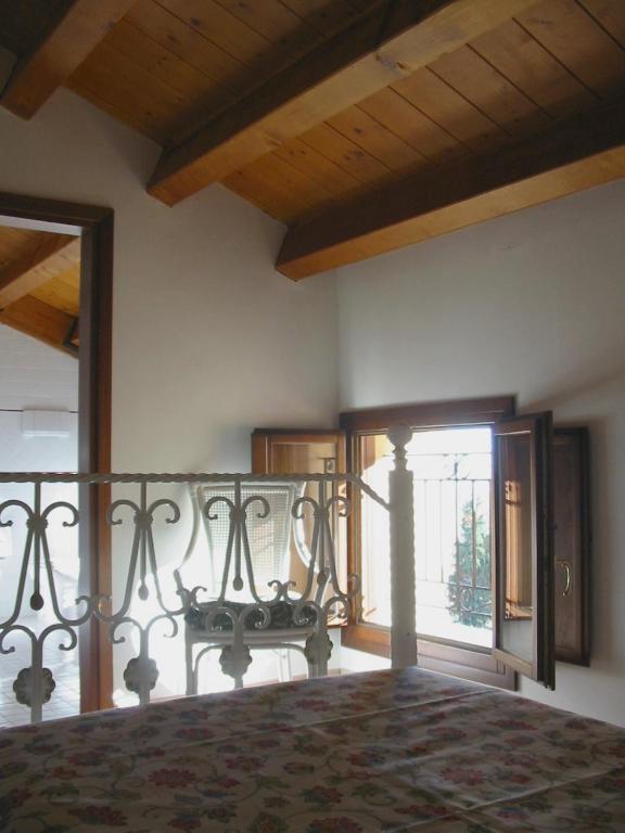 Postel nebo postele na pokoji v ubytování Villa Scalabrini