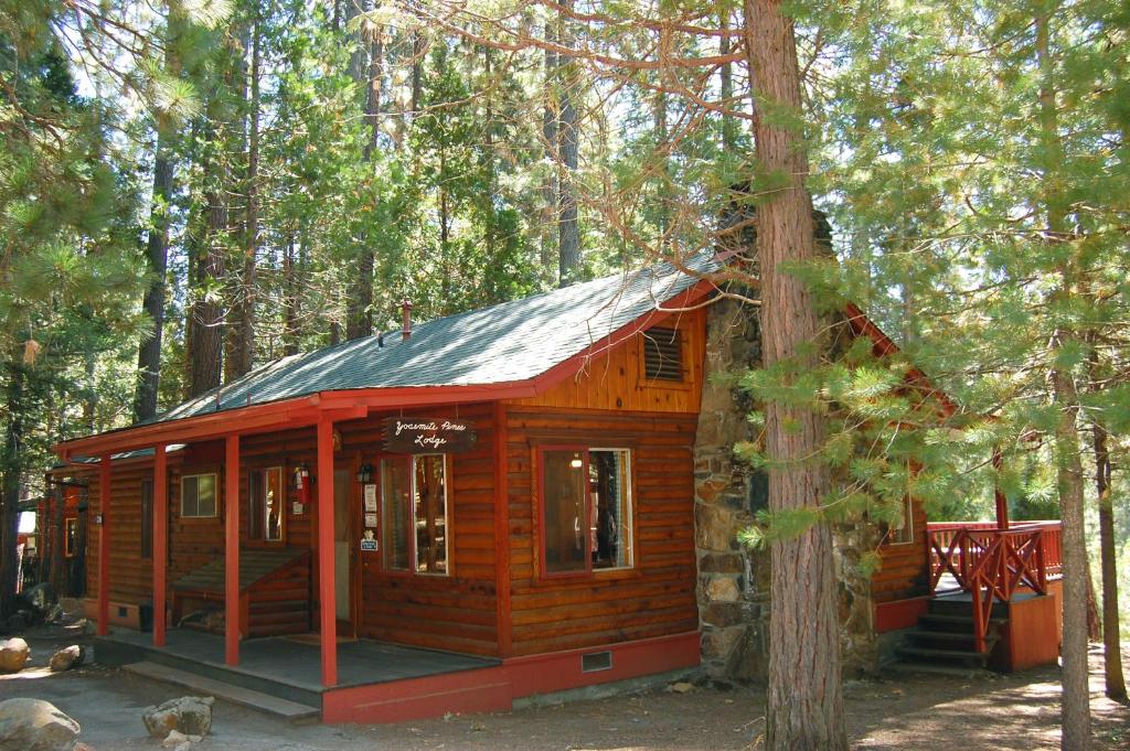 a wooden cabin in the middle of a forest at 3N Lockwood Lodge in Wawona