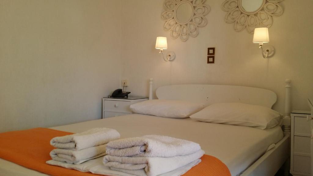 Postel nebo postele na pokoji v ubytování Rachel Hotel