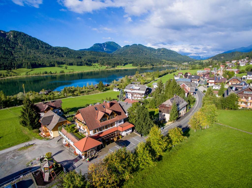 an aerial view of a town with a lake and mountains at Ferienhaus Holzer in Weissensee