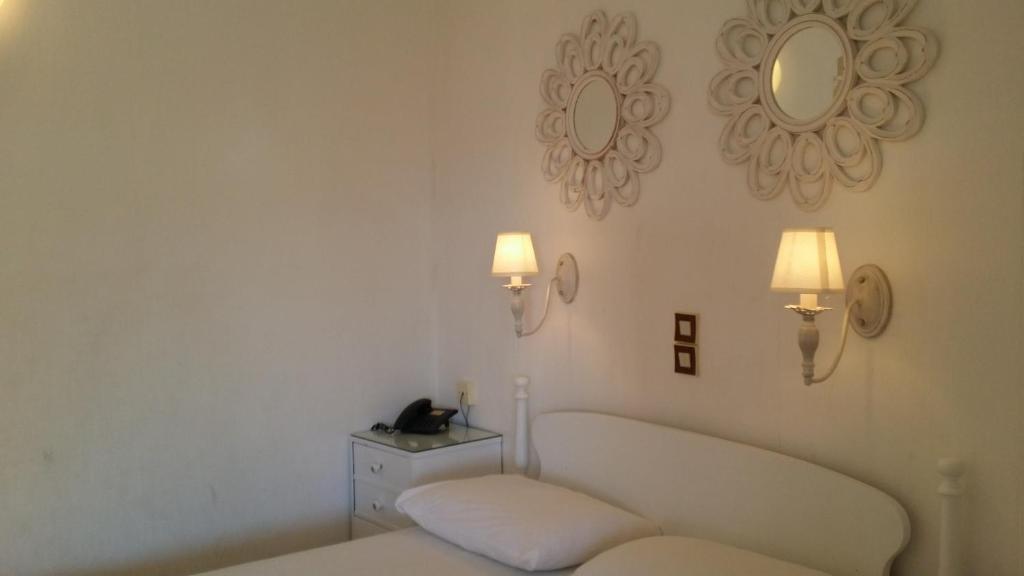 Postel nebo postele na pokoji v ubytování Rachel Hotel
