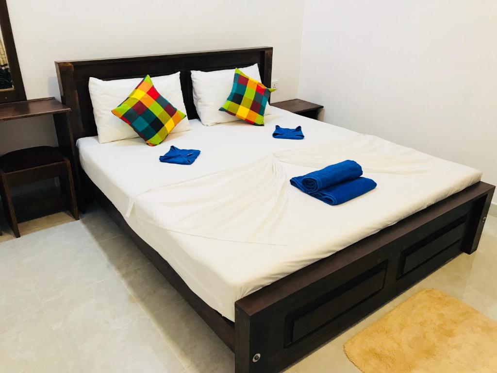 Postel nebo postele na pokoji v ubytování Pearl House Resort