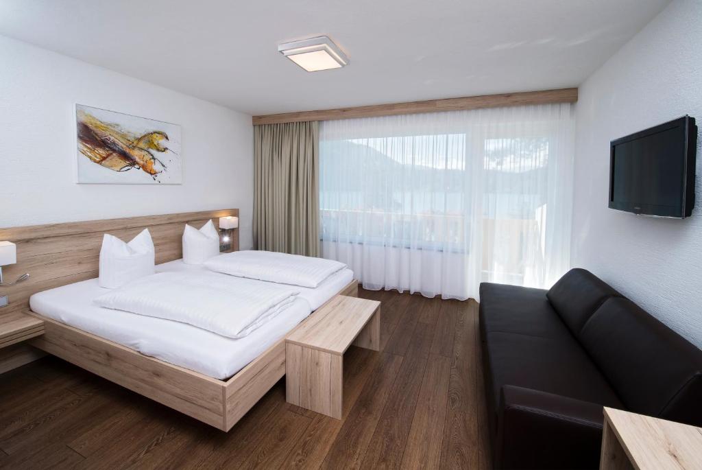 Postel nebo postele na pokoji v ubytování Terrassenhotel Reichmann