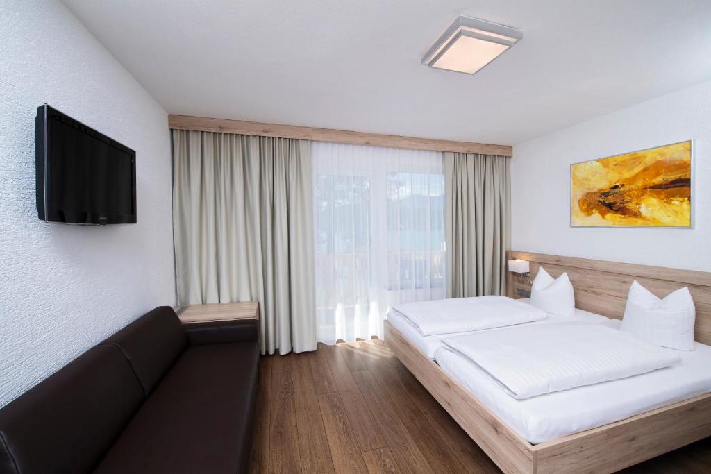 Postel nebo postele na pokoji v ubytování Terrassenhotel Reichmann