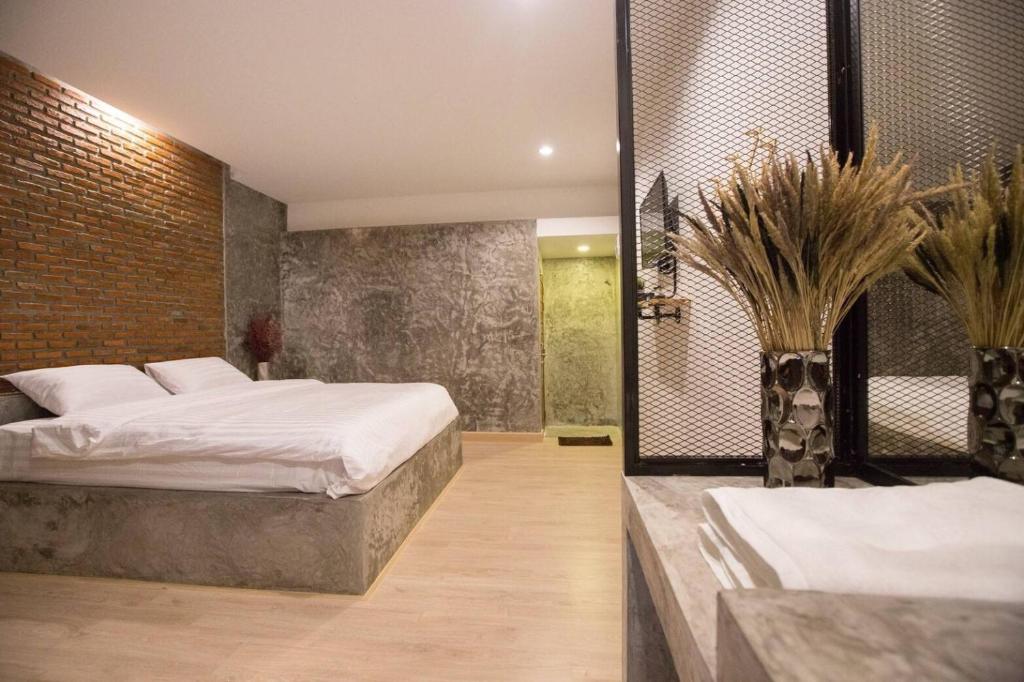 Postel nebo postele na pokoji v ubytování Pimchanok Resort