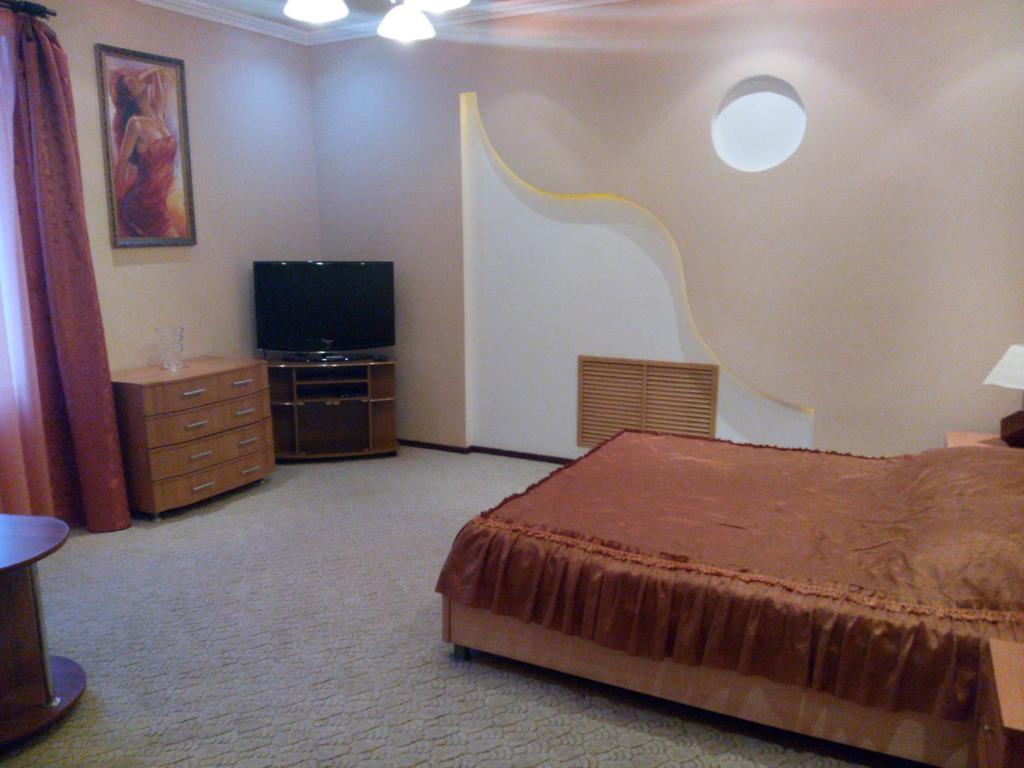 
Кровать или кровати в номере Grand-Hotel
