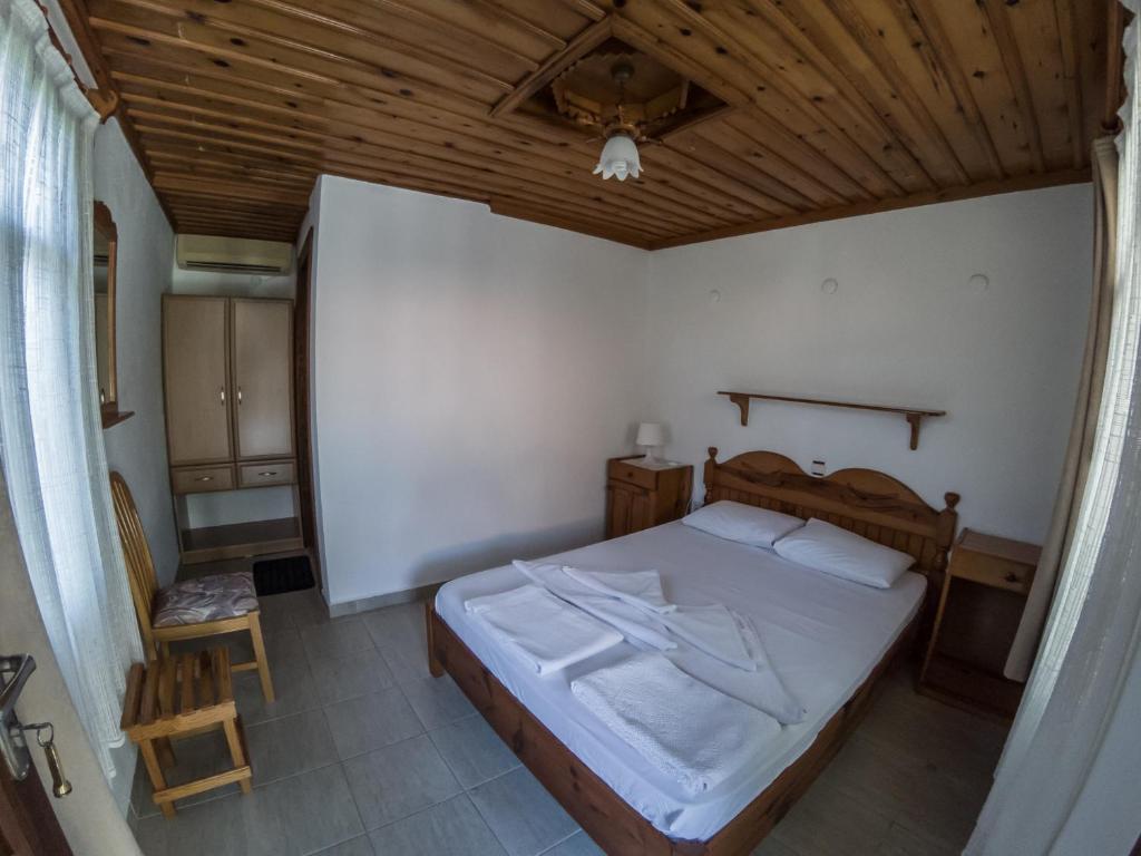 Postel nebo postele na pokoji v ubytování Midas Pension