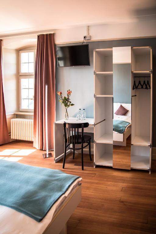 Postel nebo postele na pokoji v ubytování Kreuz Herzogenbuchsee
