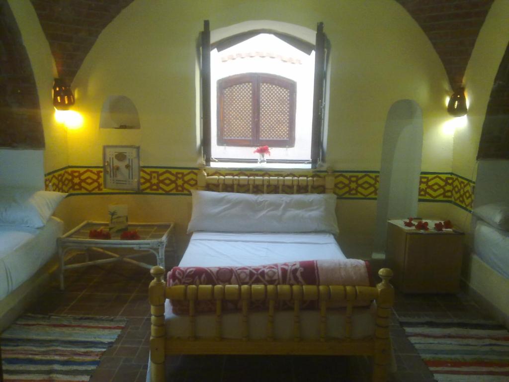 Postel nebo postele na pokoji v ubytování Al Baeirat Hotel