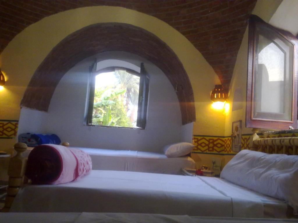 Postel nebo postele na pokoji v ubytování Al Baeirat Hotel