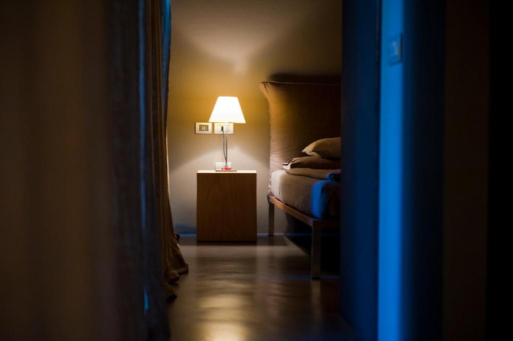 A bed or beds in a room at Vivere Suites & Rooms