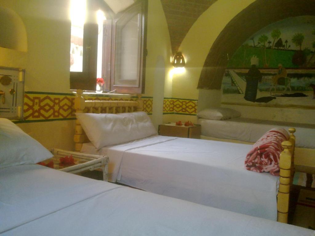 Postel nebo postele na pokoji v ubytování Al Baeirat Hotel