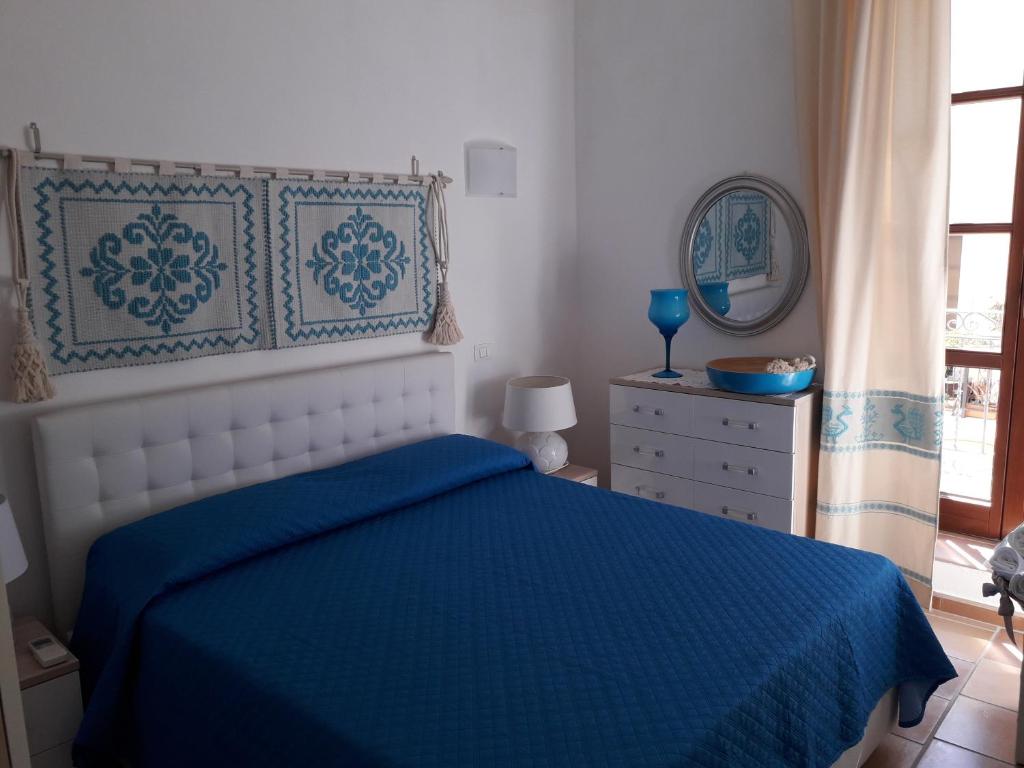 Postel nebo postele na pokoji v ubytování B&B Il Porticciolo Portoscuso