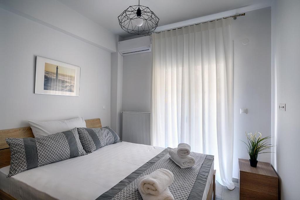 Posteľ alebo postele v izbe v ubytovaní Heliconia deluxe Apt Must