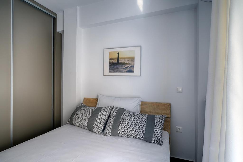Posteľ alebo postele v izbe v ubytovaní Heliconia deluxe Apt Must