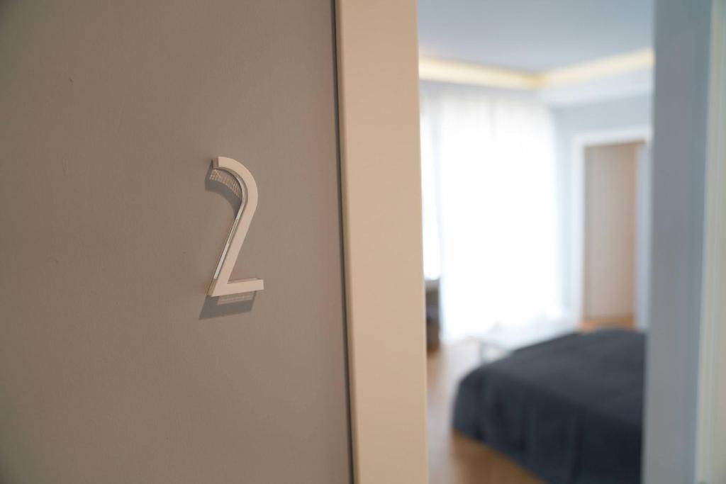 a door with a number on it in a room at Room 56 in Bari