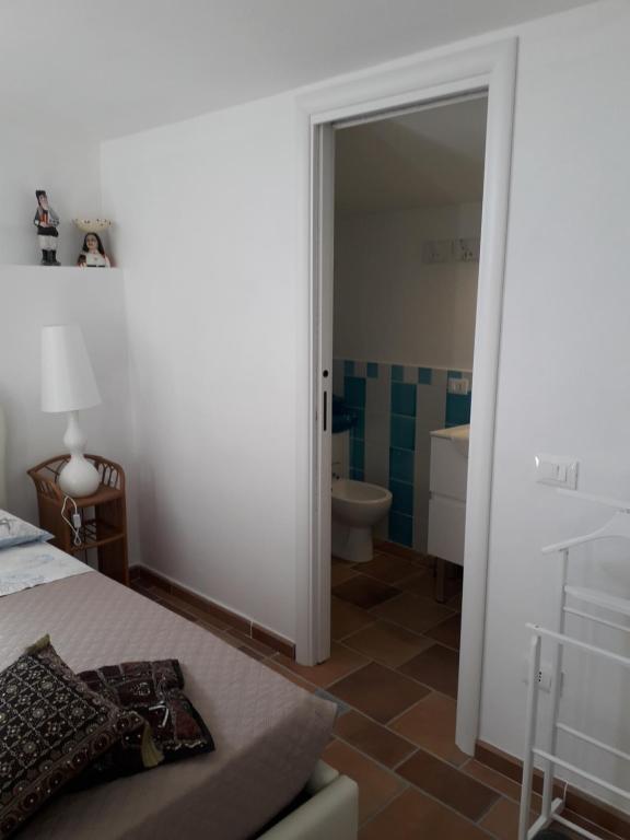 Postel nebo postele na pokoji v ubytování B&B Il Porticciolo Portoscuso