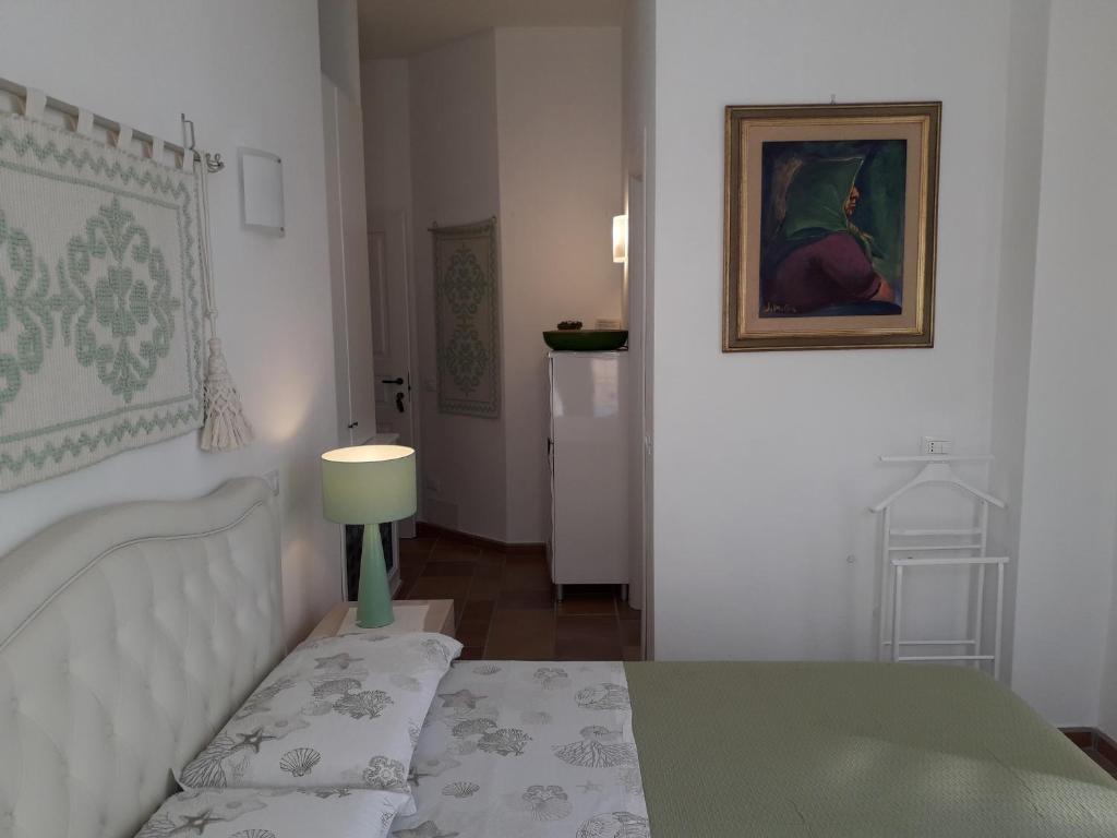 Postel nebo postele na pokoji v ubytování B&B Il Porticciolo Portoscuso