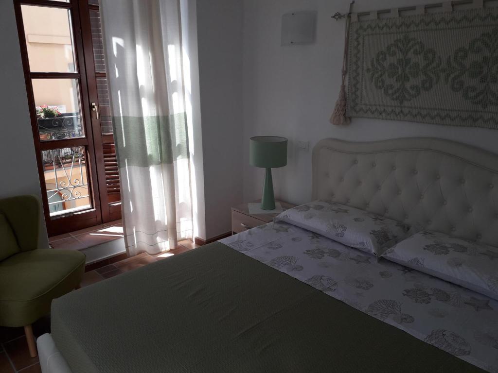 Postel nebo postele na pokoji v ubytování B&B Il Porticciolo Portoscuso