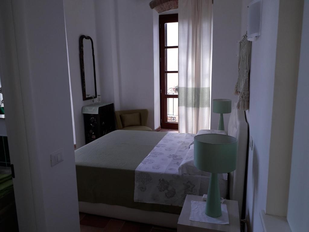 Postel nebo postele na pokoji v ubytování B&B Il Porticciolo Portoscuso
