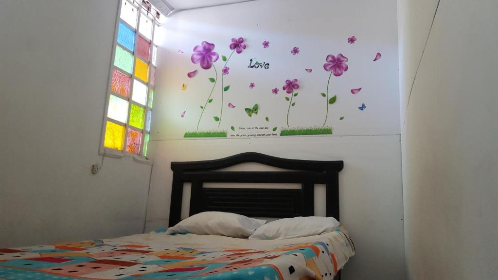 Ένα ή περισσότερα κρεβάτια σε δωμάτιο στο Hostal Balcony
