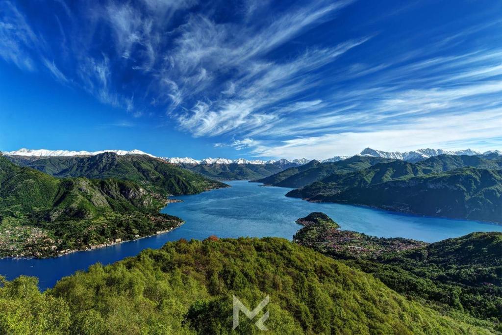 an aerial view of a lake in the mountains at Appartamenti 1 in Dervio