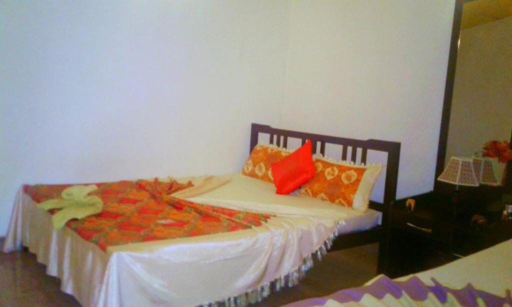 Postel nebo postele na pokoji v ubytování River Retreat Sigiriya