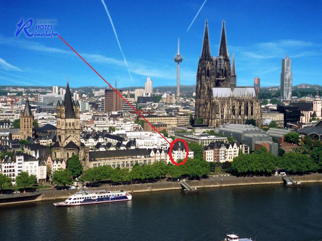 a view of a city with a red circle at Hotel Römerhafen in Cologne