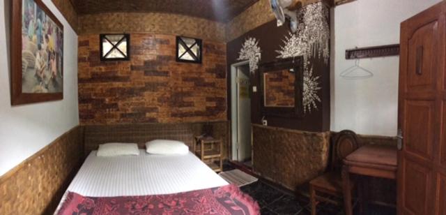 Postel nebo postele na pokoji v ubytování Mini Tiga Homestay