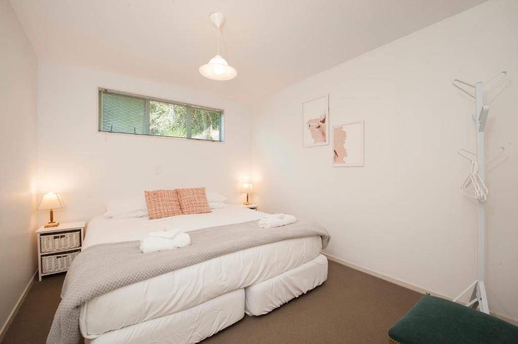 a bedroom with a bed with two towels on it at Robins Nest in Russell