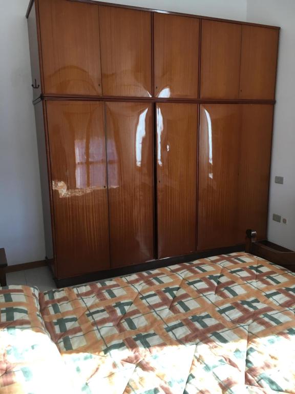 Łóżko lub łóżka w pokoju w obiekcie Residence IL PORTO