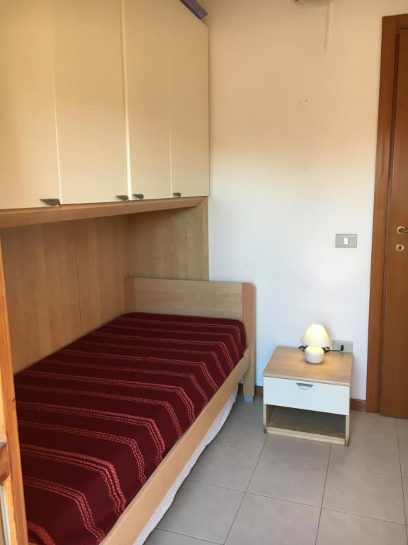 Łóżko lub łóżka w pokoju w obiekcie Residence IL PORTO