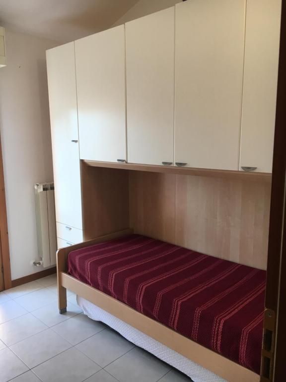Łóżko lub łóżka w pokoju w obiekcie Residence IL PORTO