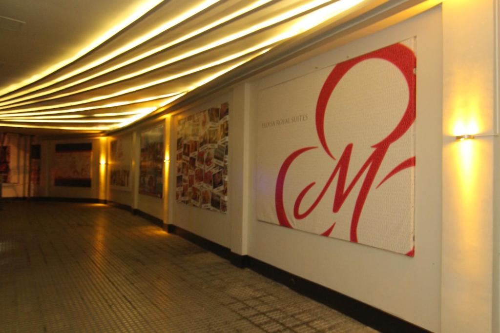 a hallway with a sign on the side of a building at Eloisa Royal Suites in Mactan