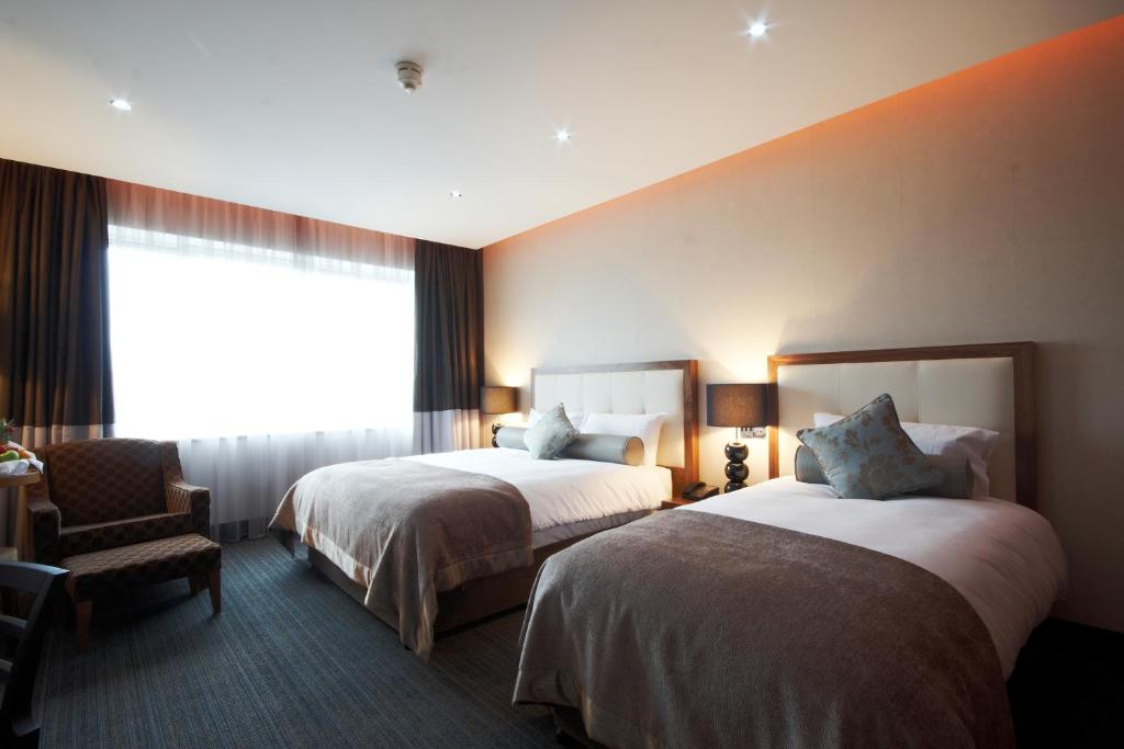 Postel nebo postele na pokoji v ubytování Rochestown Park Hotel & Leisure Centre