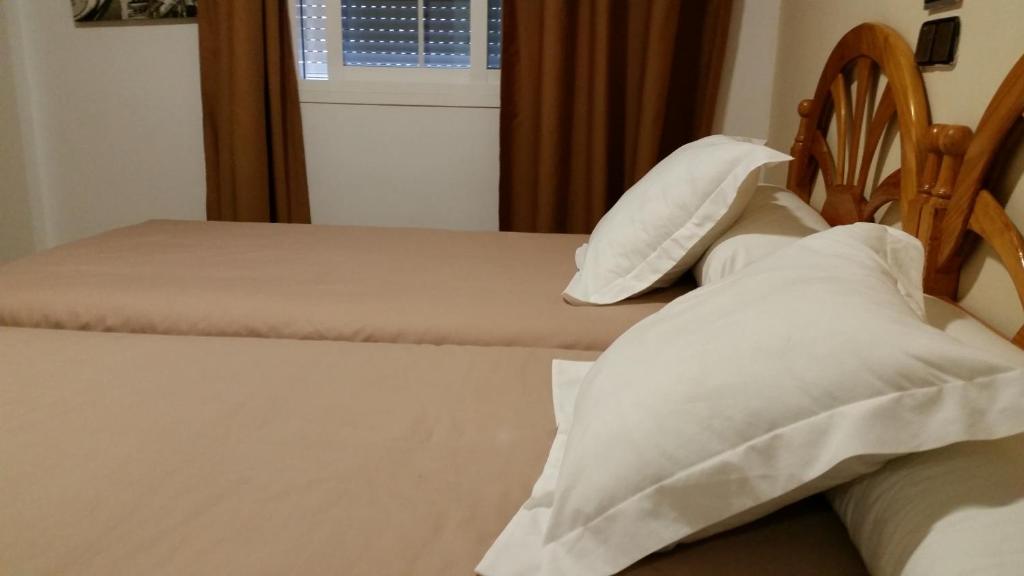 Postel nebo postele na pokoji v ubytování Hotel Balcón de Cazorla