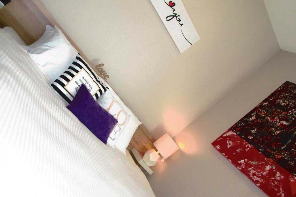 Posteľ alebo postele v izbe v ubytovaní HNM Homestay Mesahill Nilai KLIA