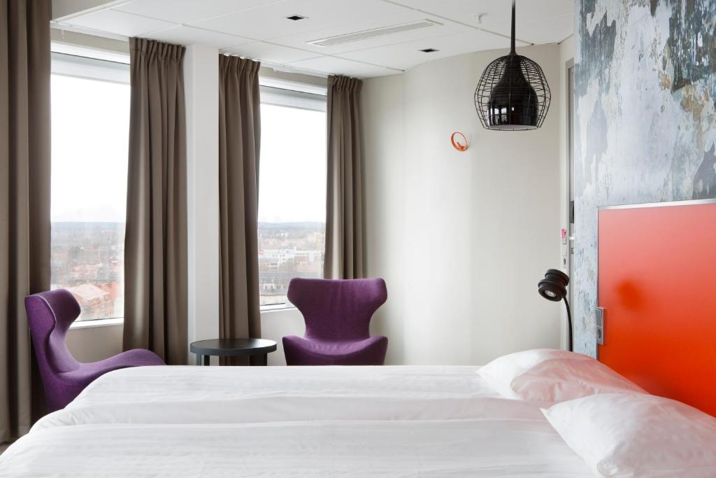 Postel nebo postele na pokoji v ubytování Comfort Hotel Winn