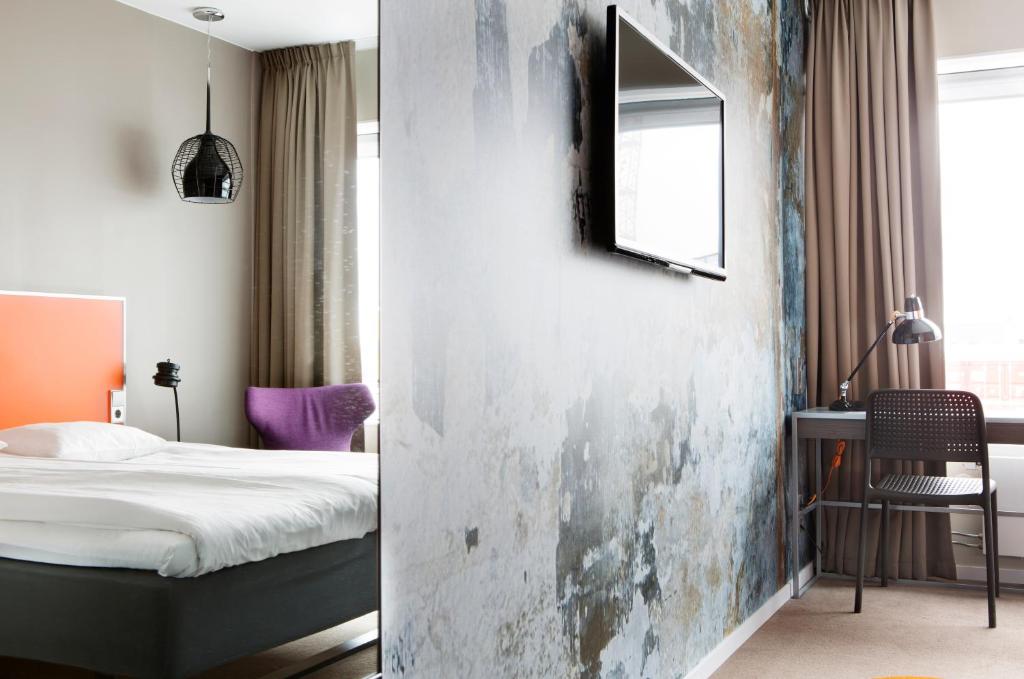 Postel nebo postele na pokoji v ubytování Comfort Hotel Winn