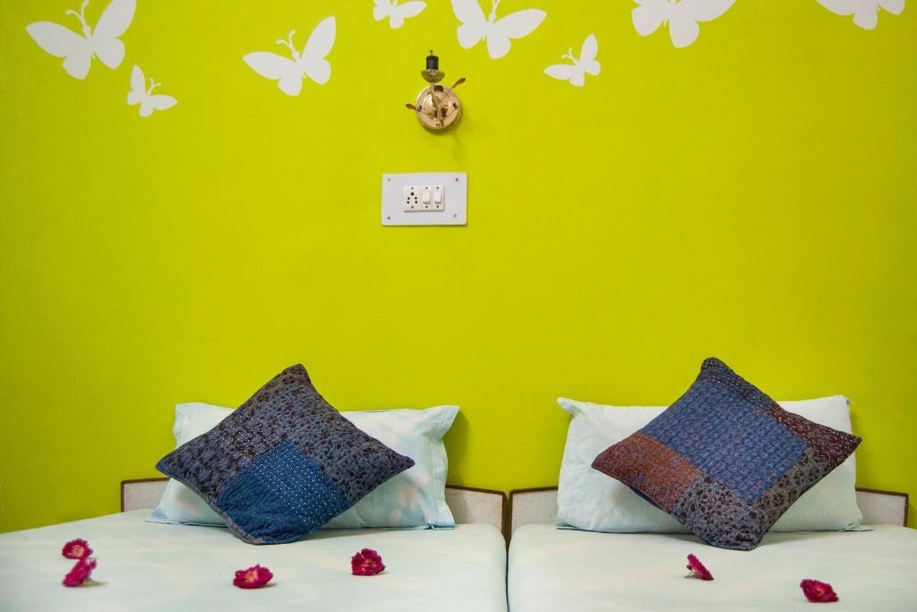 Postel nebo postele na pokoji v ubytování Hotel Rising Star