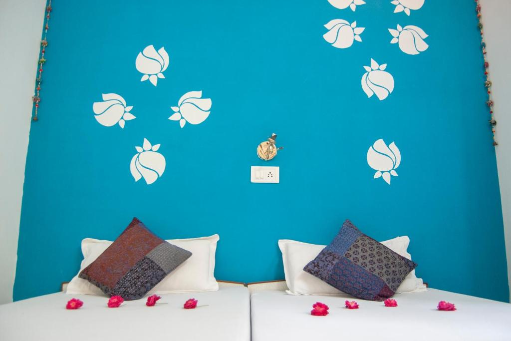Postel nebo postele na pokoji v ubytování Hotel Rising Star